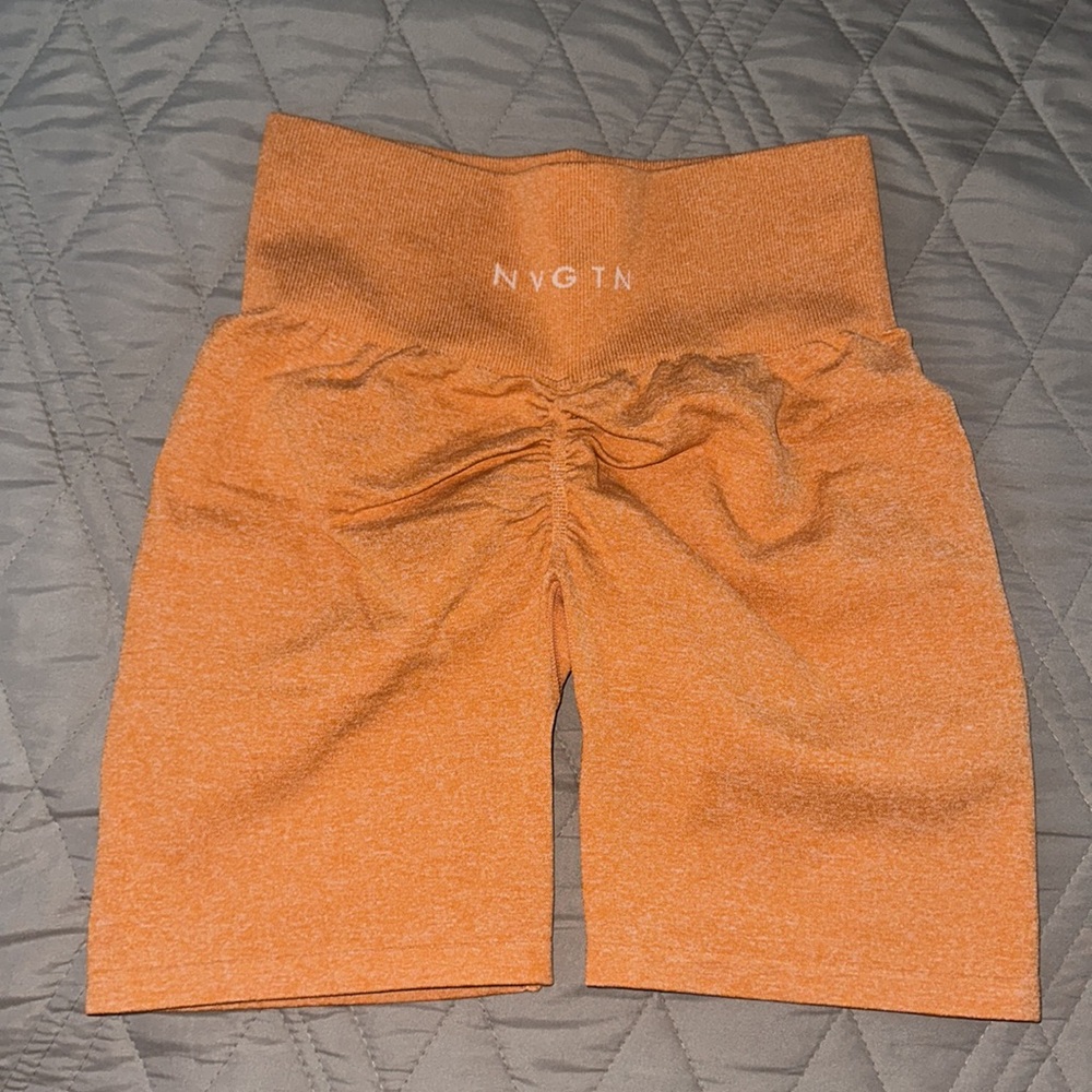 NVGTN orange scrunch biker shorts